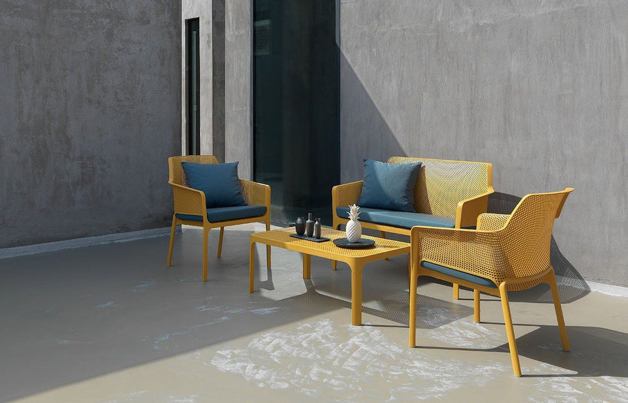 Environmental image of EZ Hospitality Net Outdoor Lounge Chair - Bench with Light Grey Pad