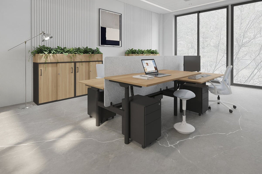 Environmental image of Flexi Premium Height Adjustable 4 Person H-Bench Workstation - Black Frame [1600L x 800W with Cable Scallop]