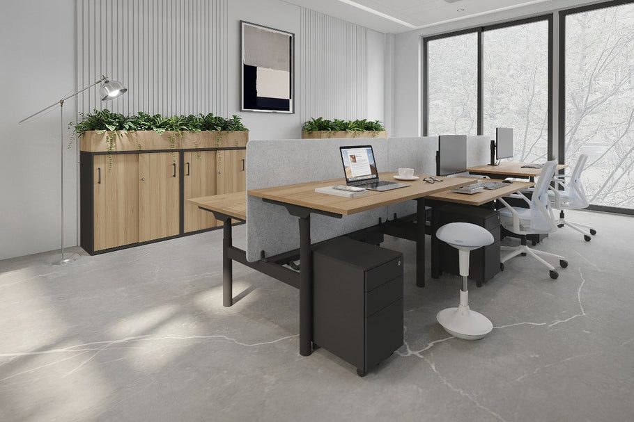 Environmental image of Flexi Premium Height Adjustable 6 Person H-Bench Workstation - Black Frame [1200L x 700W]